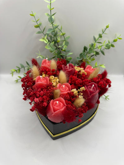 Dekorativer Kerzenblumenstrauß